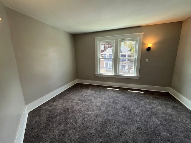917 Walnut St, Erie, PA 16502 - unfurnished room with dark carpet and baseboards