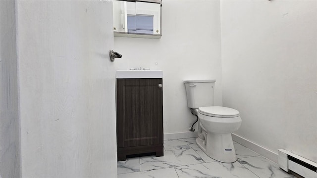 bathroom featuring vanity, a baseboard radiator, and toilet