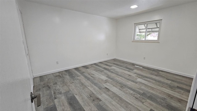 unfurnished room featuring hardwood / wood-style floors