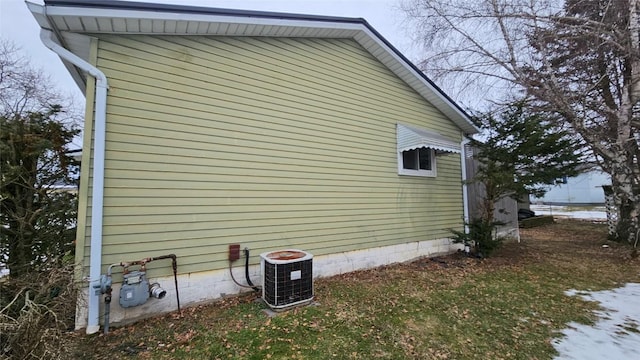 view of property exterior with central AC unit