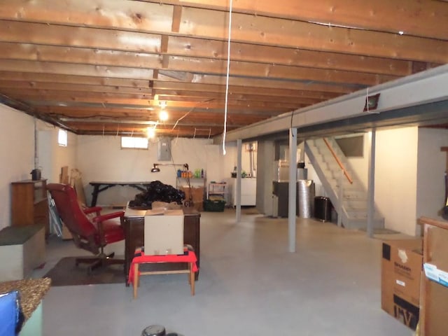 basement with washer / clothes dryer and electric panel