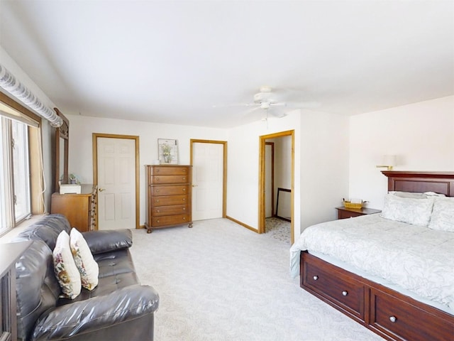 bedroom featuring light carpet and ceiling fan