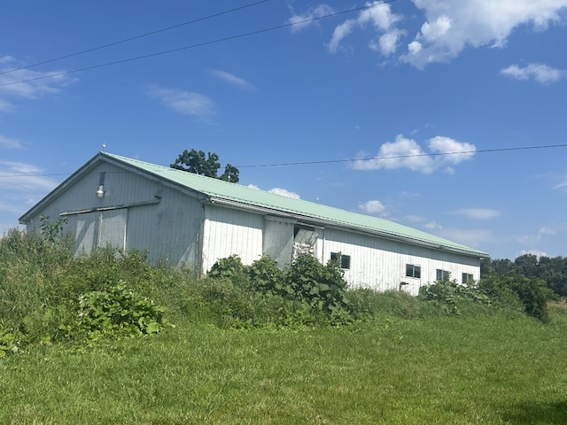 495 E Jamestown Rd, Greenville, PA 16125 - view of side of home featuring a metal roof, an outdoor structure, and a pole building