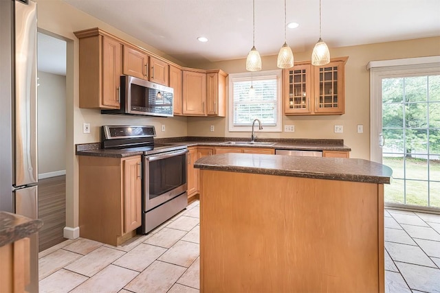 2861 S Birch Run, Millcreek, PA 16506 - kitchen featuring appliances with stainless steel finishes, dark countertops, a center island, glass insert cabinets, and recessed lighting