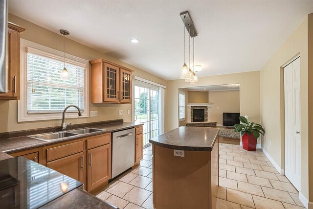2861 S Birch Run, Millcreek, PA 16506 - kitchen with dishwasher, dark countertops, a kitchen island, a fireplace with raised hearth, and glass insert cabinets