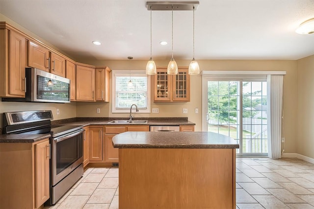 2861 S Birch Run, Millcreek, PA 16506 - kitchen featuring appliances with stainless steel finishes, dark countertops, a kitchen island, glass insert cabinets, and hanging light fixtures