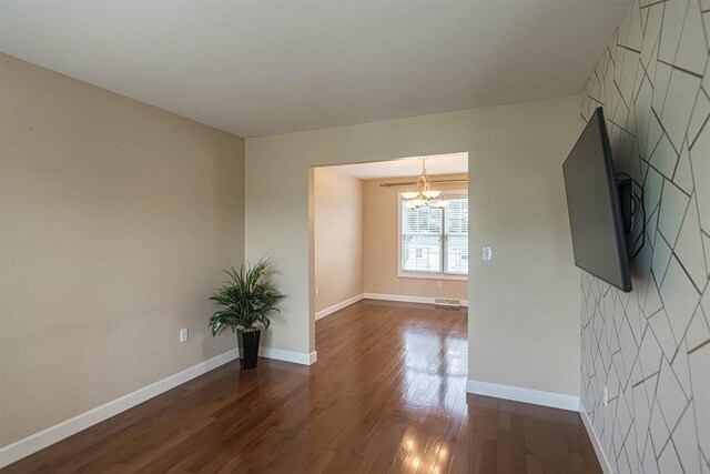 2861 S Birch Run, Millcreek, PA 16506 - unfurnished room with wood finished floors and a chandelier