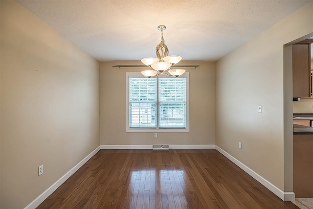 2861 S Birch Run, Millcreek, PA 16506 - unfurnished dining area featuring a chandelier and dark wood finished floors