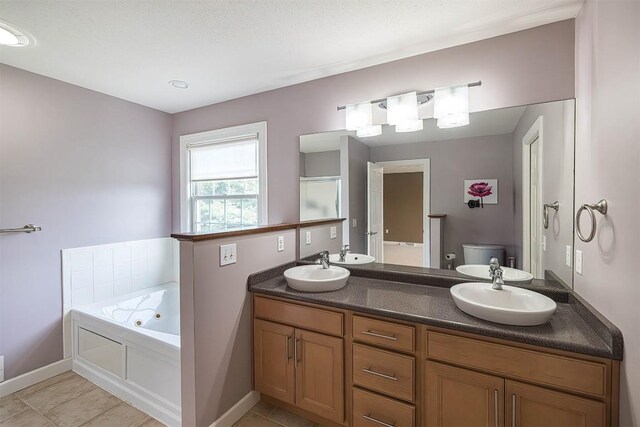 2861 S Birch Run, Millcreek, PA 16506 - full bathroom with a jetted tub, double vanity, and tile patterned floors