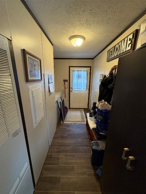 doorway with a textured ceiling