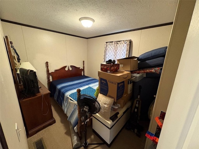 carpeted bedroom featuring crown molding and a textured ceiling