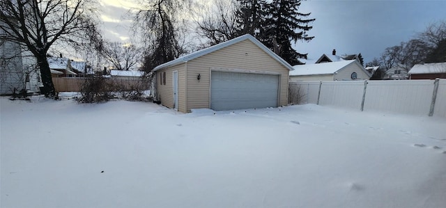 view of snow covered garage