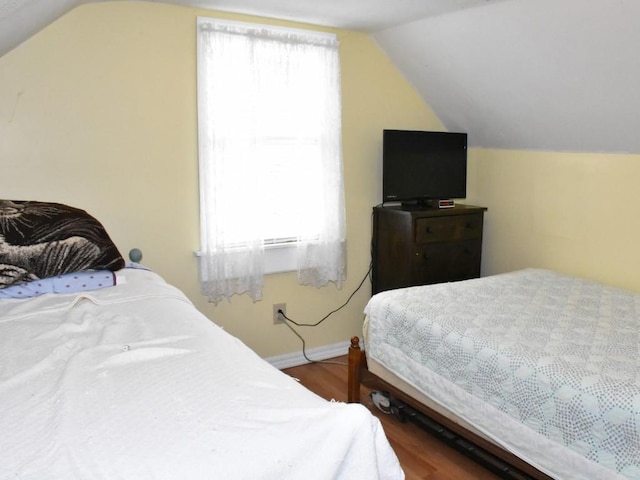 10987 Henry St, Conneaut Lake, PA 16316 - bedroom with lofted ceiling and wood finished floors