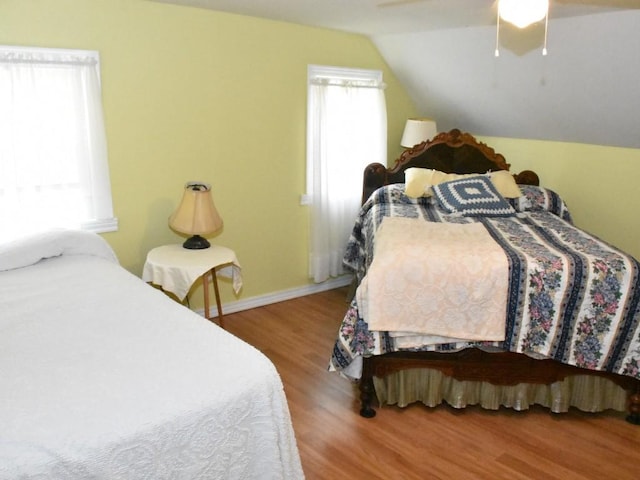 10987 Henry St, Conneaut Lake, PA 16316 - bedroom with wood finished floors, vaulted ceiling, and a ceiling fan