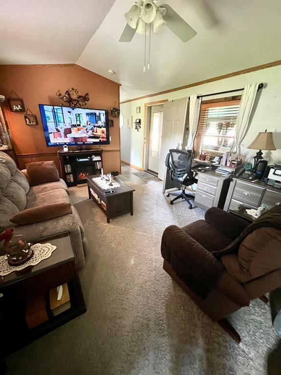 50 Maplenut Ln, Erie, PA 16510 - living room with lofted ceiling, ceiling fan, carpet, and a desk