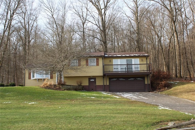 view of front facade with a garage and a front lawn