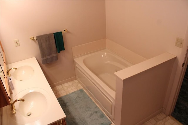 bathroom featuring a bathtub and vanity