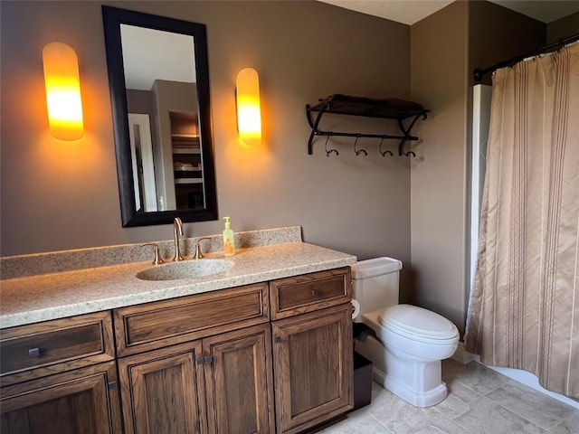 bathroom with tile patterned floors, vanity, and toilet