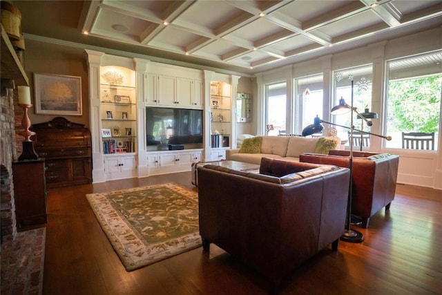 living room featuring coffered ceiling, built in features, beamed ceiling, dark hardwood / wood-style floors, and ornamental molding