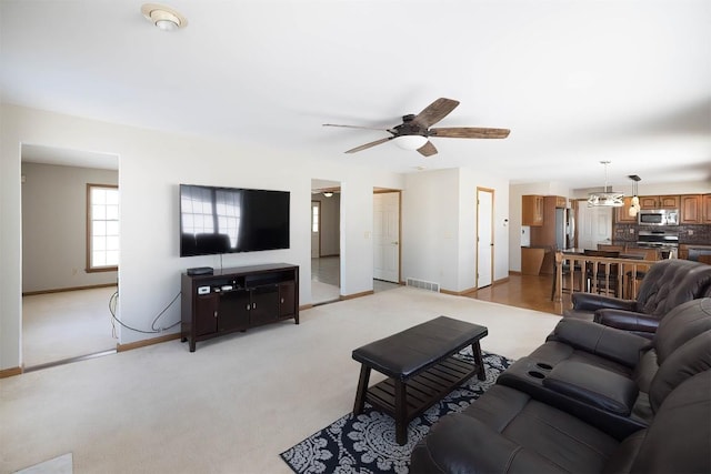 3706 Harbor Ridge Trl, Erie, PA 16510 - living area featuring baseboards, ceiling fan, and light colored carpet