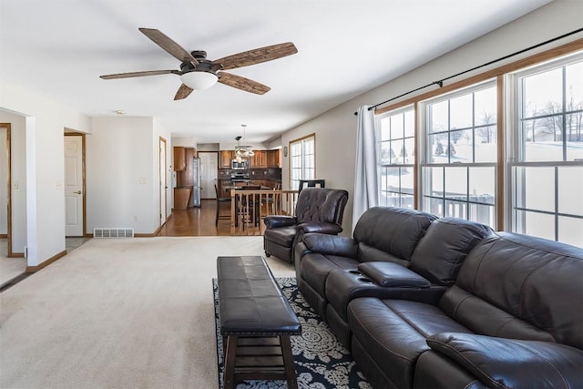 3706 Harbor Ridge Trl, Erie, PA 16510 - living room featuring a ceiling fan, baseboards, and light carpet
