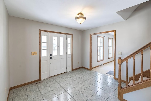 3706 Harbor Ridge Trl, Erie, PA 16510 - entrance foyer featuring healthy amount of natural light, baseboards, stairway, and light tile patterned flooring