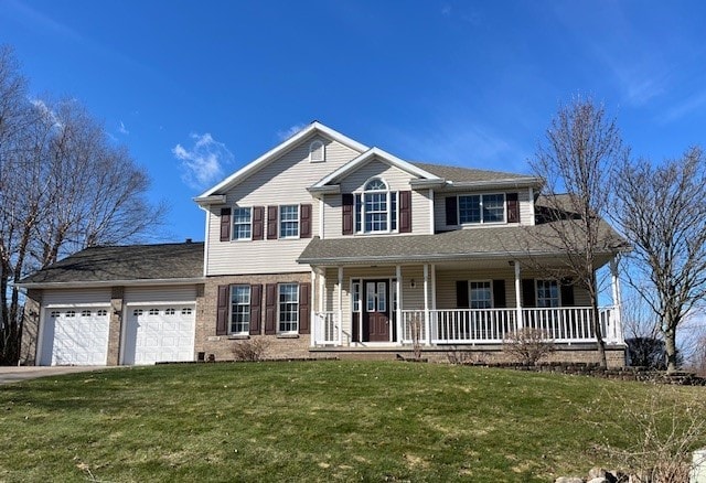 3706 Harbor Ridge Trl, Erie, PA 16510 - view of front facade with an attached garage, covered porch, a front yard, and driveway