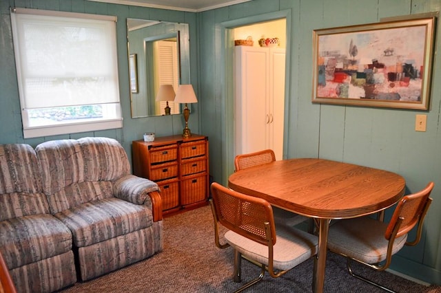 105 Hickory St, Edinboro, PA 16412 - carpeted dining area featuring ornamental molding and a decorative wall