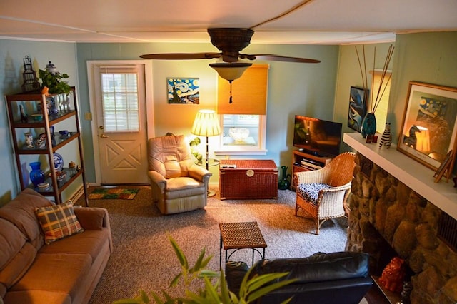105 Hickory St, Edinboro, PA 16412 - living area with carpet, a ceiling fan, and a fireplace