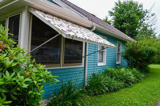 105 Hickory St, Edinboro, PA 16412 - view of home's exterior featuring roof with shingles and a yard