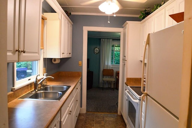 105 Hickory St, Edinboro, PA 16412 - kitchen with white appliances, ceiling fan, and white cabinetry