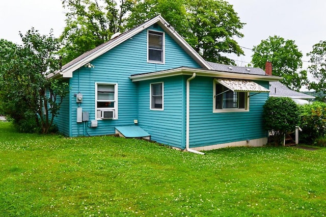 105 Hickory St, Edinboro, PA 16412 - rear view of property with a chimney, a lawn, and cooling unit