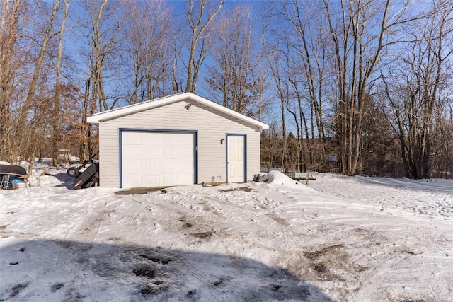 view of snow covered garage