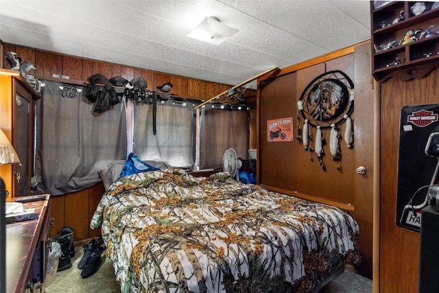 carpeted bedroom with wood walls