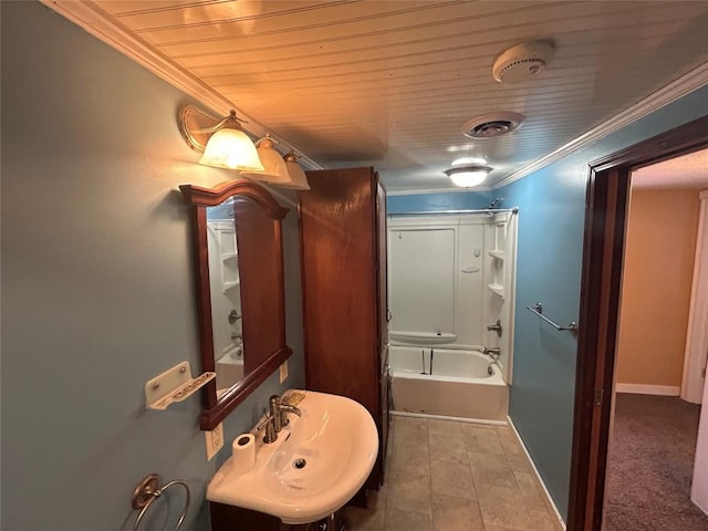 bathroom featuring sink, shower / bathtub combination, and ornamental molding