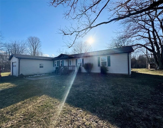 view of front of property with a garage and a front yard