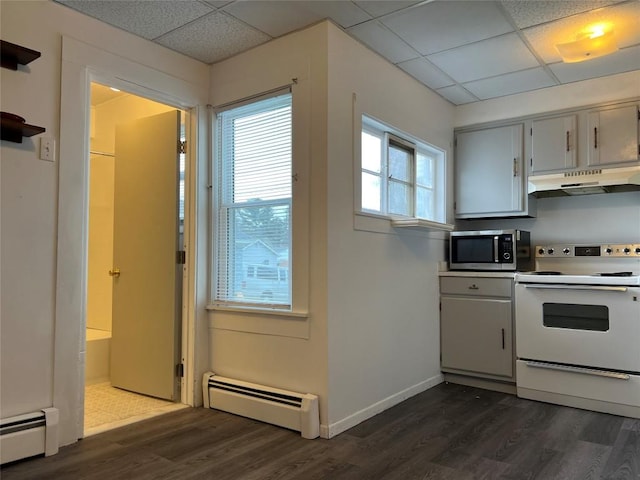 kitchen featuring a paneled ceiling, a baseboard heating unit, and electric stove