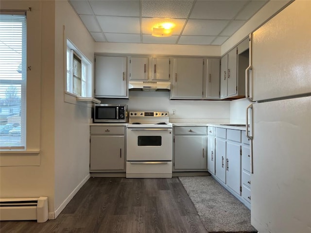 kitchen with gray cabinetry, a drop ceiling, white appliances, and a baseboard heating unit