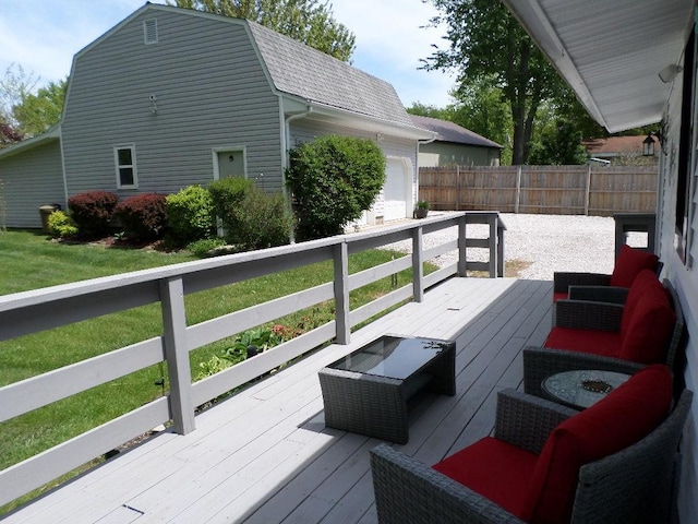 wooden deck featuring fence and an attached garage