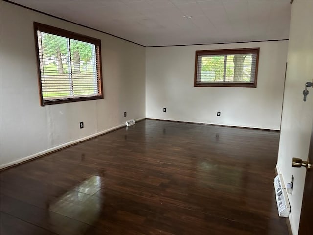 empty room featuring dark hardwood / wood-style floors