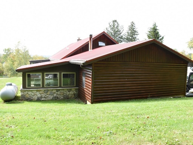 view of property exterior with a yard