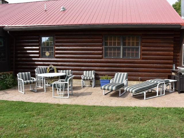 back of property featuring a patio area