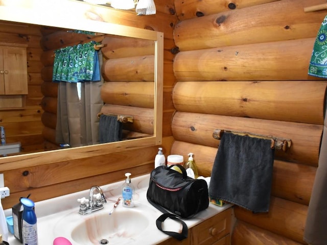 bathroom featuring toilet, sink, and log walls