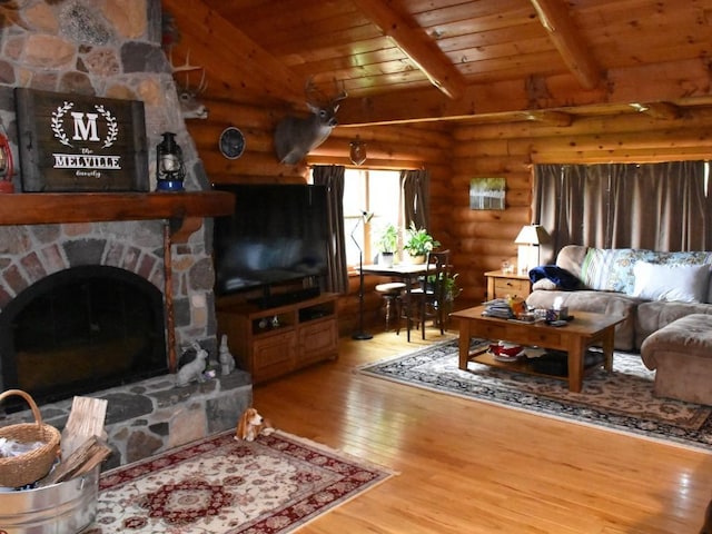 living room featuring log walls, wood-type flooring, wooden ceiling, vaulted ceiling with beams, and a stone fireplace