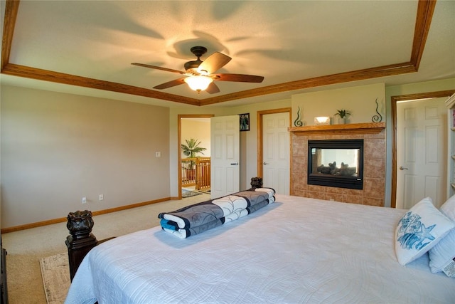 6020 Pebble Creek Dr, Fairview, PA 16415 - bedroom featuring a raised ceiling, a tiled fireplace, carpet floors, ceiling fan, and ornamental molding