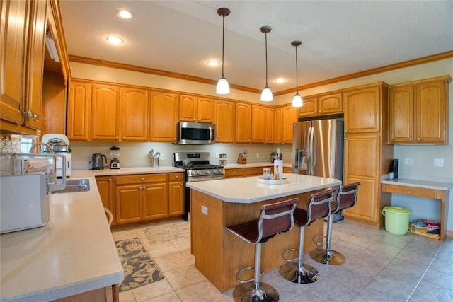 6020 Pebble Creek Dr, Fairview, PA 16415 - kitchen featuring stainless steel appliances, ornamental molding, a center island, brown cabinetry, and a breakfast bar area