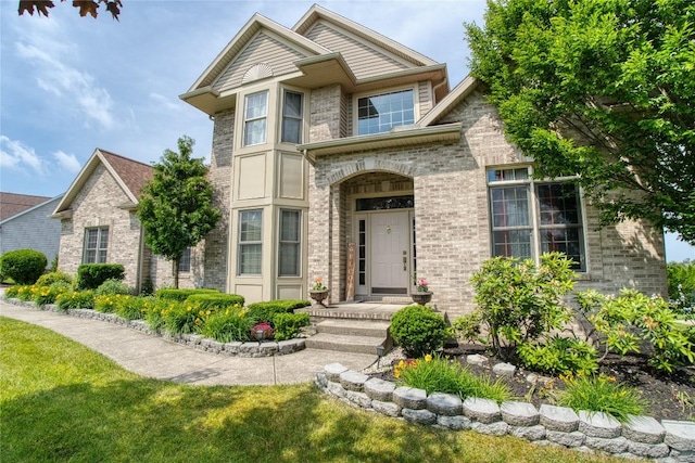 6020 Pebble Creek Dr, Fairview, PA 16415 - view of front facade with brick siding and a front lawn
