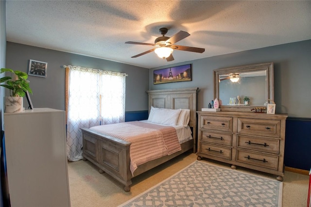 6020 Pebble Creek Dr, Fairview, PA 16415 - bedroom with light carpet, a textured ceiling, and a ceiling fan