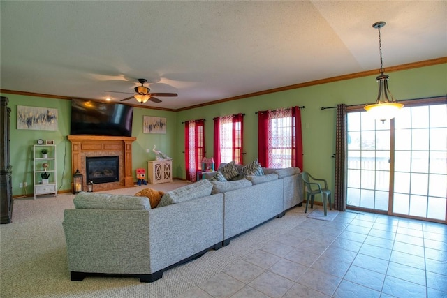 6020 Pebble Creek Dr, Fairview, PA 16415 - living room featuring ceiling fan, crown molding, a glass covered fireplace, and tile patterned floors