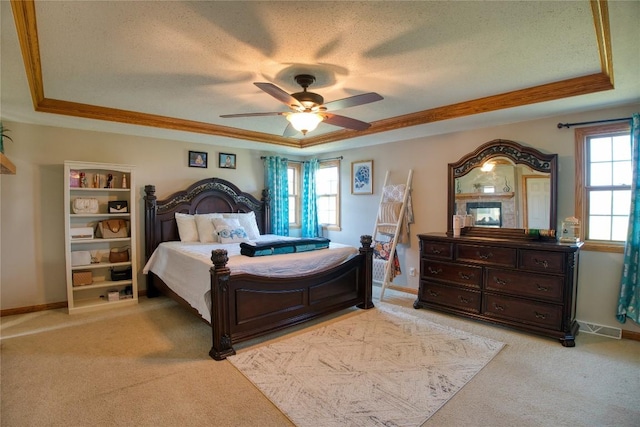 6020 Pebble Creek Dr, Fairview, PA 16415 - bedroom with a tray ceiling, light carpet, crown molding, a textured ceiling, and ceiling fan